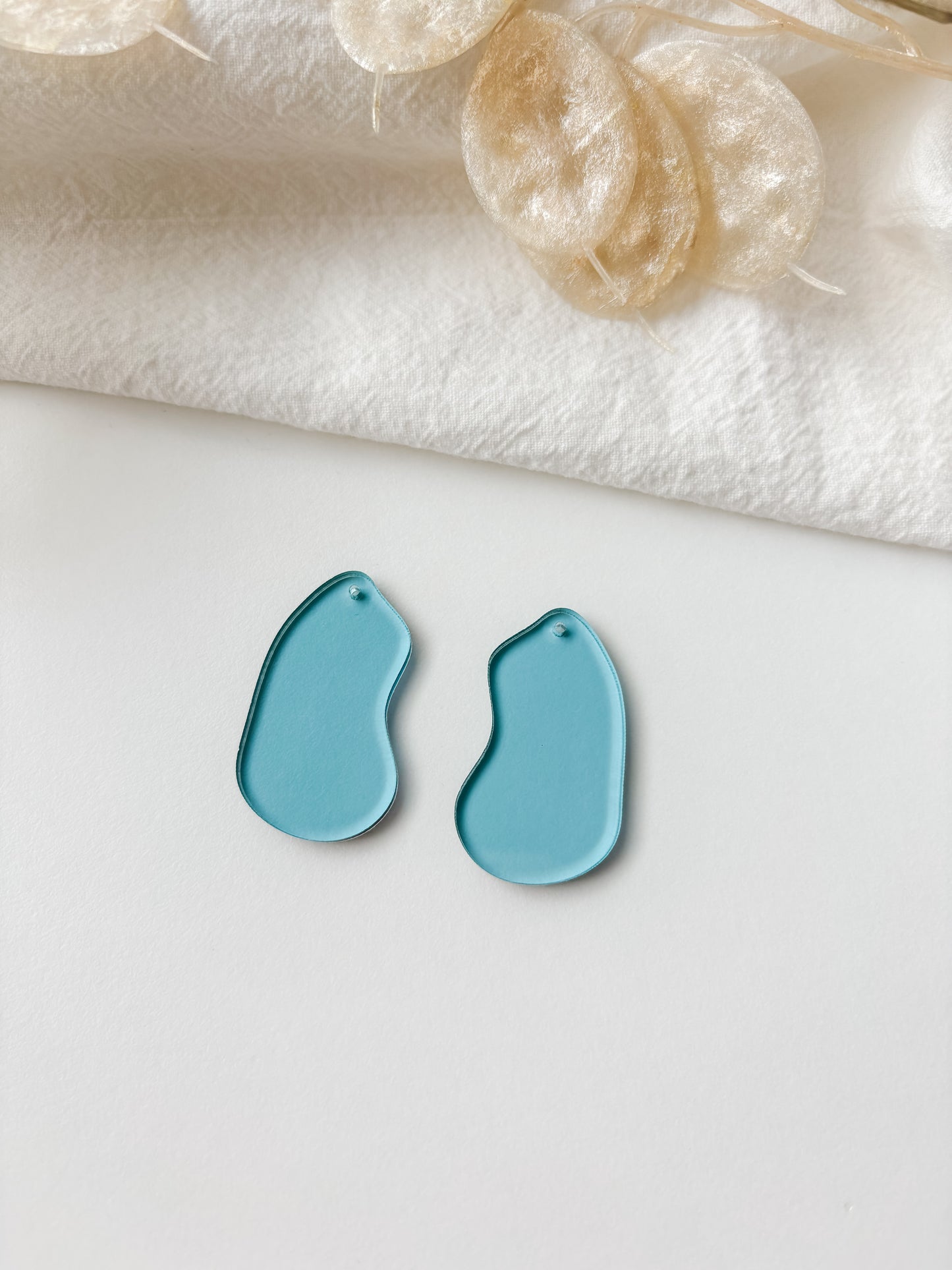 Pendant blue transparent 40mm