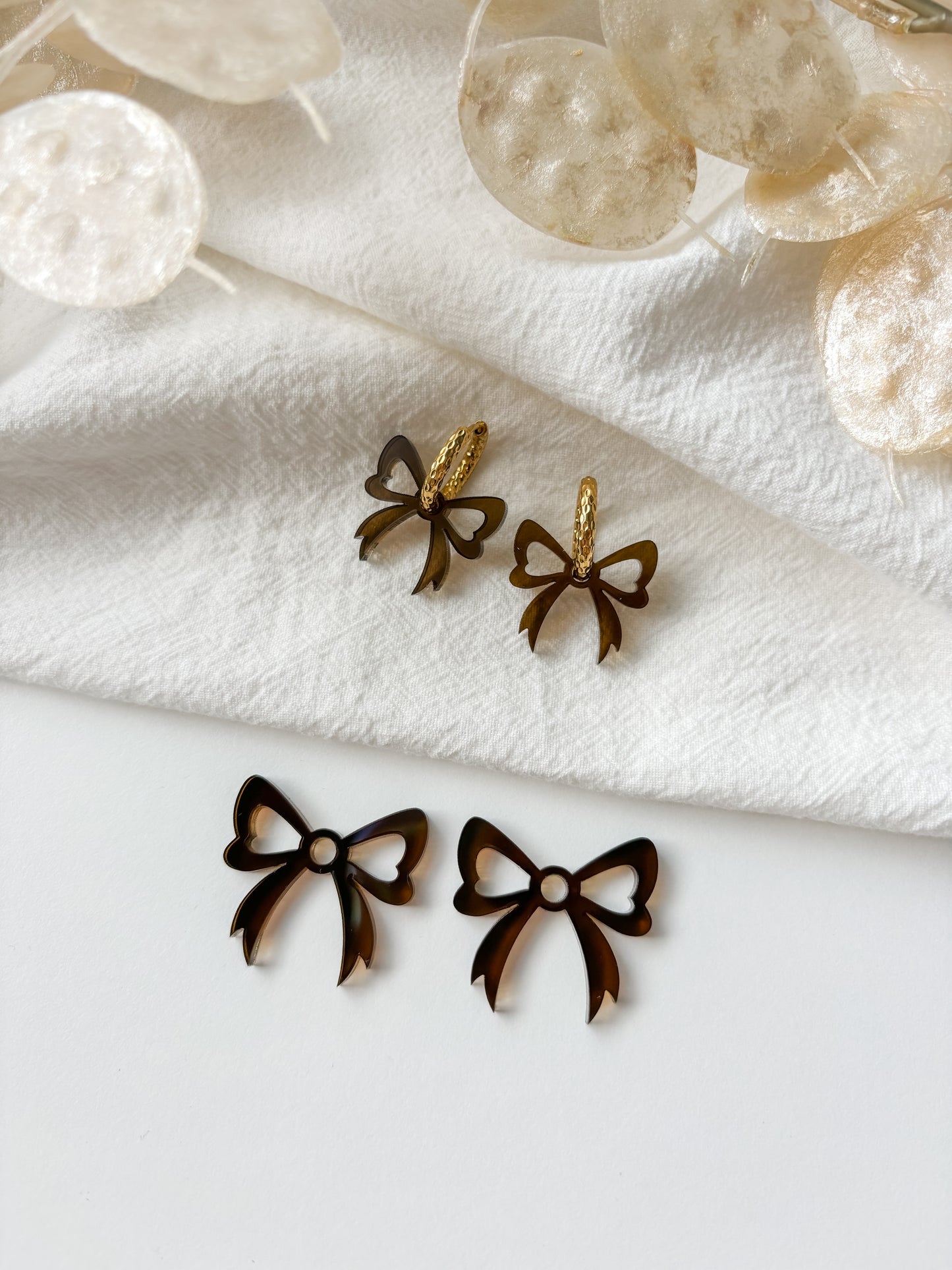Pendant bow, transparent brown, 1 pair