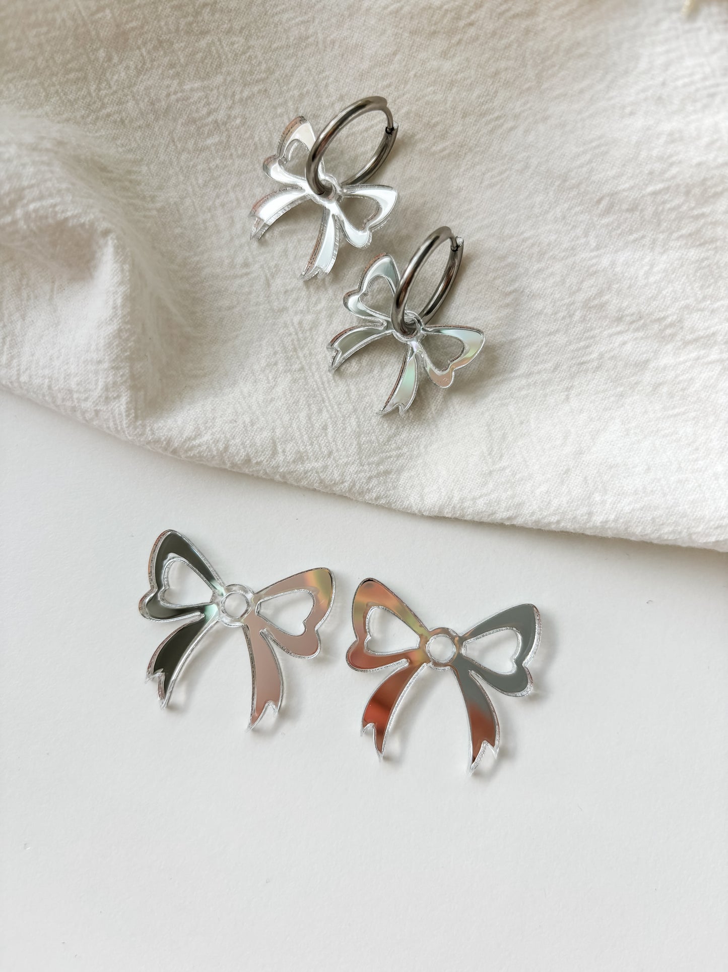 Pendant bow, silver mirror acrylic, 1 pair