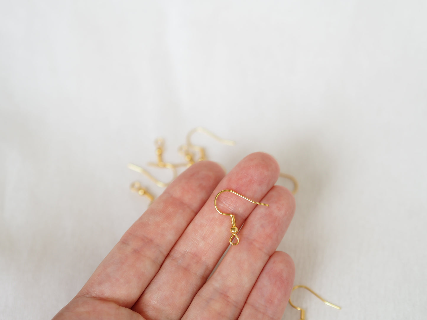 Korvakorukoukku 20x20mm, rst, 18k kullattu, 10paria