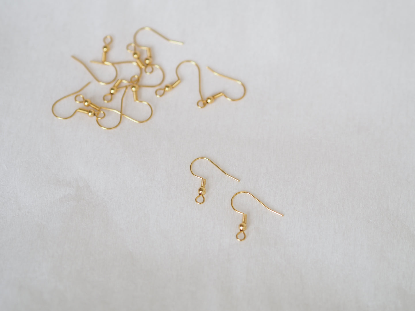 Korvakorukoukku 20x20mm, rst, 18k kullattu, 10paria